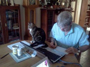 Julian at work with Kitty by his side